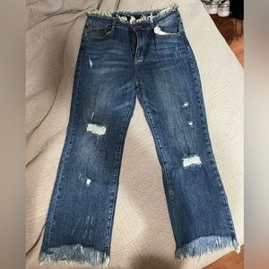 Distressed Blue Jeans with Frayed Hem